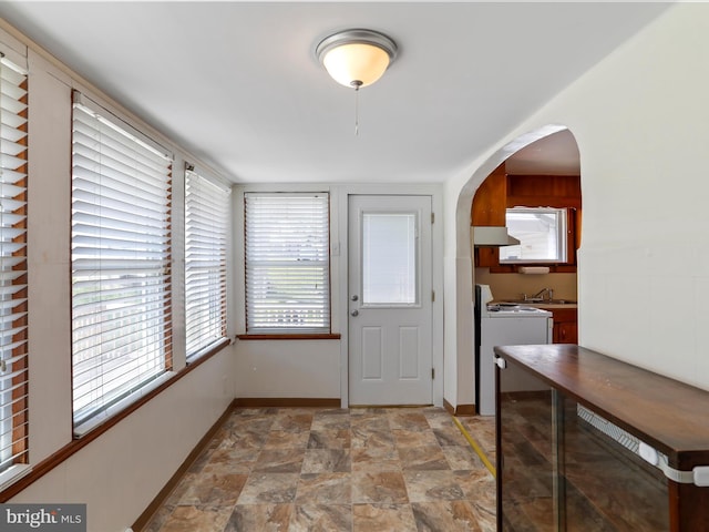 819 Manns Ter, Cumberland, MD 21502 - entrance foyer featuring arched walkways, baseboards, and stone finish flooring
