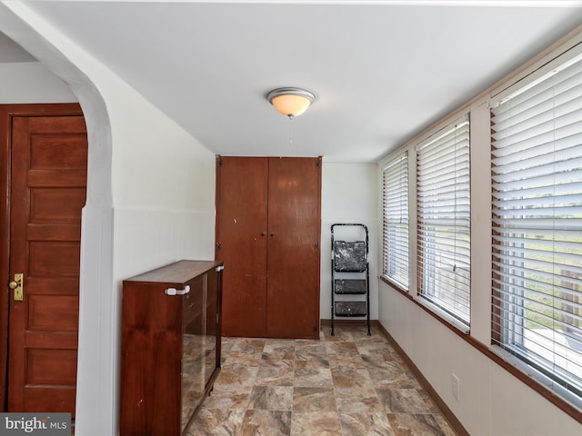 819 Manns Ter, Cumberland, MD 21502 - hall with arched walkways and stone finish flooring