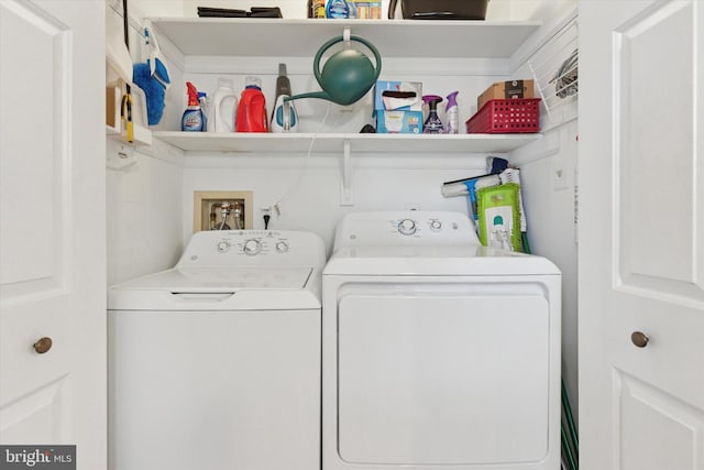 laundry area featuring washer and clothes dryer and laundry area