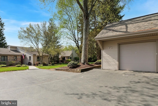 view of property exterior featuring a garage