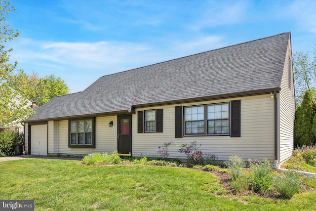 view of front of house with a garage, roof with shingles, concrete driveway, and a front lawn