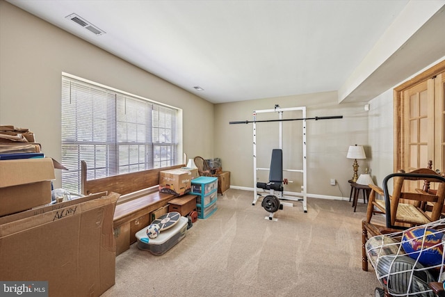 sitting room featuring baseboards, carpet flooring, and visible vents