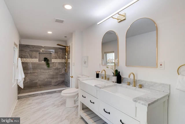 bathroom featuring visible vents, marble finish floor, toilet, recessed lighting, and a sink