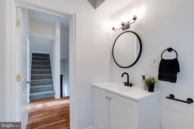 bathroom featuring wood finished floors and vanity