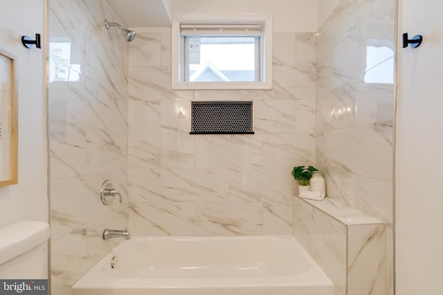full bathroom with toilet and washtub / shower combination