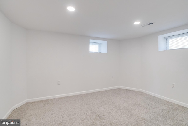 basement with carpet flooring, recessed lighting, baseboards, and visible vents