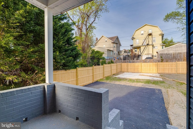 view of patio featuring fence