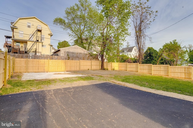 view of yard featuring a patio and a fenced backyard