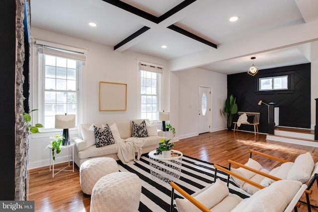 living area with beamed ceiling, recessed lighting, baseboards, and wood finished floors