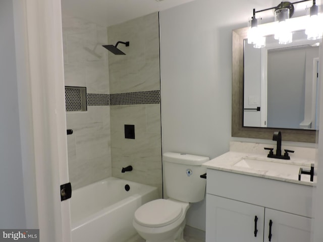 bathroom featuring vanity, toilet, and tub / shower combination