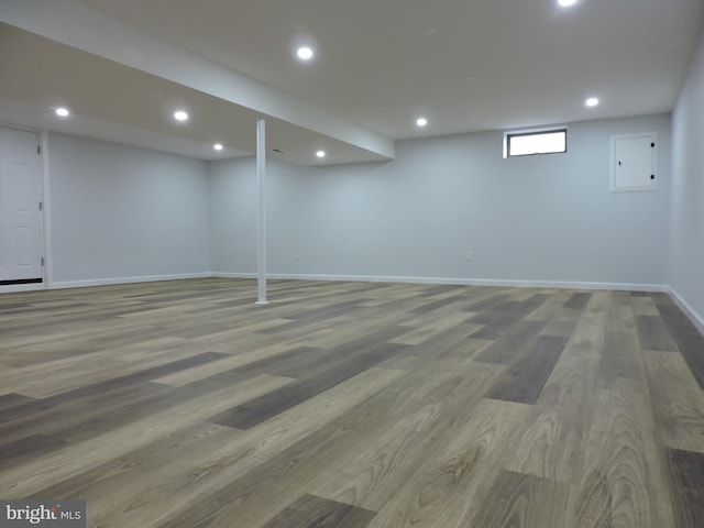 below grade area with wood finished floors, baseboards, and recessed lighting