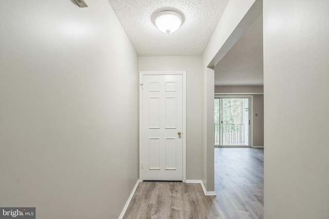 7743 Inversham Dr Unit 197, Falls Church, VA 22042 - corridor with light wood-style floors and a textured ceiling