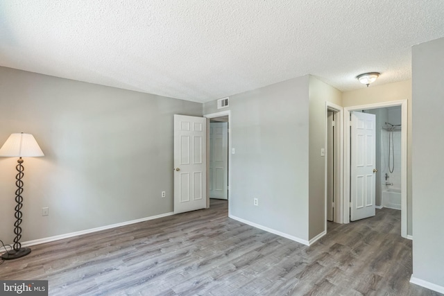 7743 Inversham Dr Unit 197, Falls Church, VA 22042 - empty room featuring wood finished floors and a textured ceiling