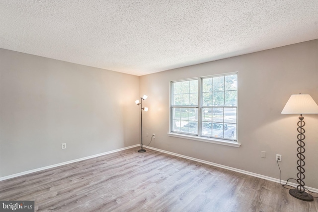 7743 Inversham Dr Unit 197, Falls Church, VA 22042 - spare room with wood finished floors and a textured ceiling