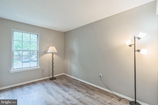 7743 Inversham Dr Unit 197, Falls Church, VA 22042 - unfurnished room featuring wood finished floors and a textured ceiling