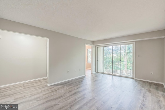 7743 Inversham Dr Unit 197, Falls Church, VA 22042 - unfurnished room with wood finished floors and a textured ceiling