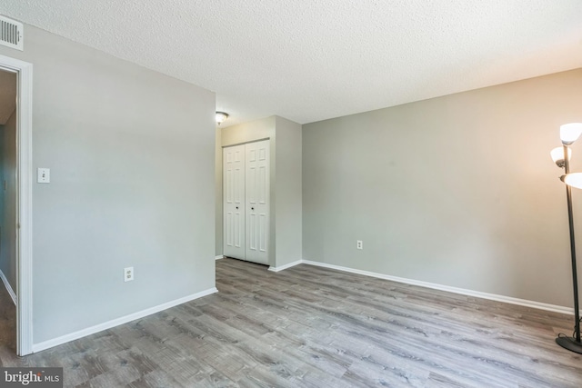 7743 Inversham Dr Unit 197, Falls Church, VA 22042 - unfurnished room featuring wood finished floors and a textured ceiling