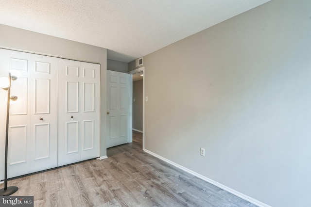 7743 Inversham Dr Unit 197, Falls Church, VA 22042 - unfurnished bedroom with wood finished floors and a closet