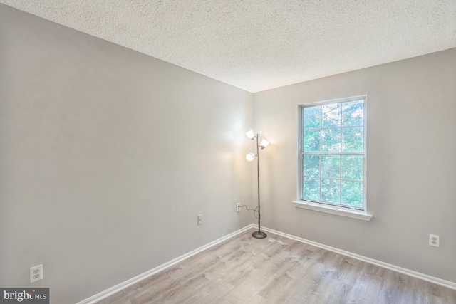 7743 Inversham Dr Unit 197, Falls Church, VA 22042 - unfurnished room featuring light wood-style floors and a textured ceiling