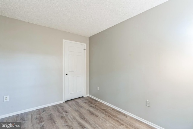 7743 Inversham Dr Unit 197, Falls Church, VA 22042 - spare room with wood finished floors and a textured ceiling