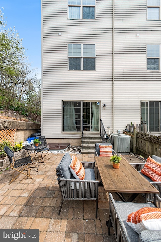 2738 Tilton St, Philadelphia, PA 19134 - rear view of property featuring entry steps, a patio, and central AC