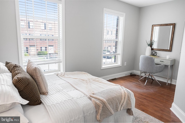 2738 Tilton St, Philadelphia, PA 19134 - bedroom featuring baseboards, visible vents, multiple windows, and wood finished floors
