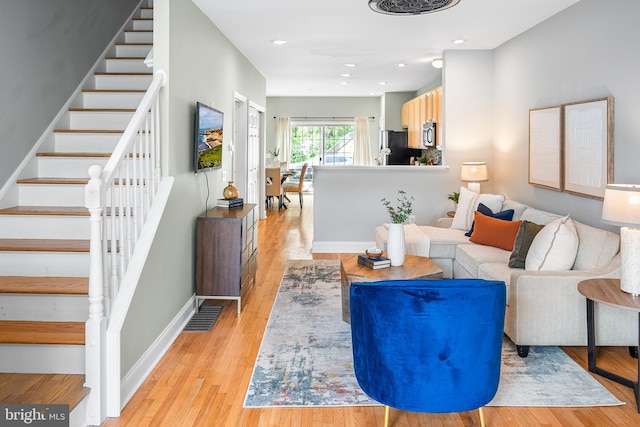 2738 Tilton St, Philadelphia, PA 19134 - living room with light wood-style floors, recessed lighting, and stairs