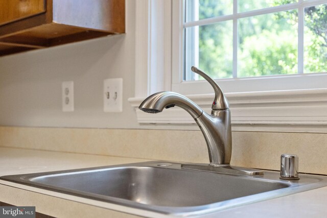 details with a sink and light countertops