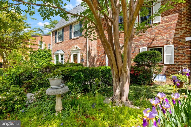 exterior space featuring brick siding