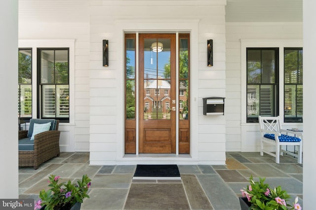 property entrance featuring covered porch