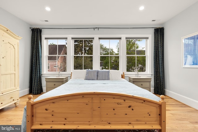 bedroom featuring recessed lighting, baseboards, and light wood-style flooring
