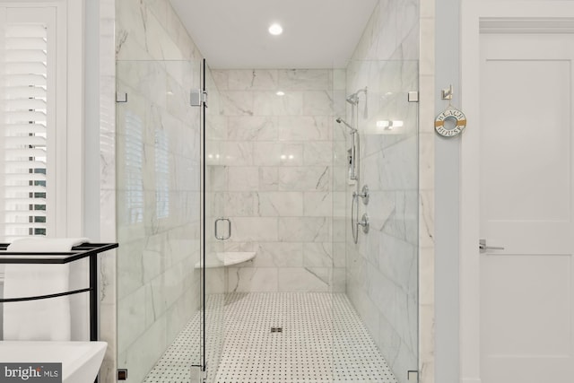 bathroom with recessed lighting and a stall shower