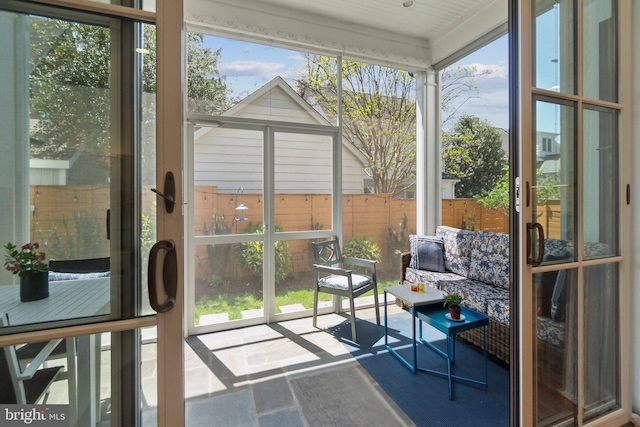 sunroom featuring plenty of natural light