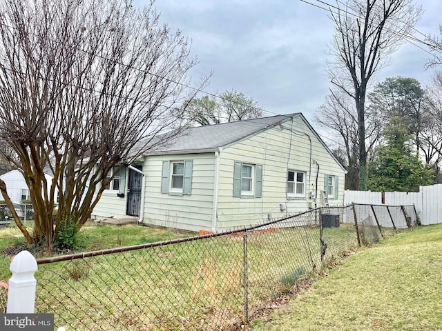 2407 Matthew Henson, Landover, MD 20785 - view of property exterior with a yard, central AC unit, and a fenced backyard