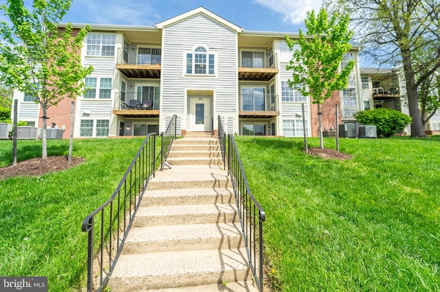 105 Water Fountain Way Unit 201, Glen Burnie, MD 21060 - exterior space with central AC and a front yard