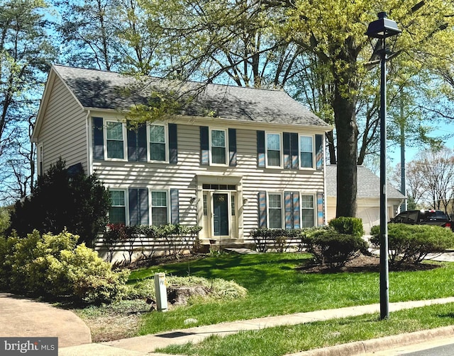 7117 Stanchion Ln, Burke, VA 22015 - colonial inspired home featuring a front yard and roof with shingles