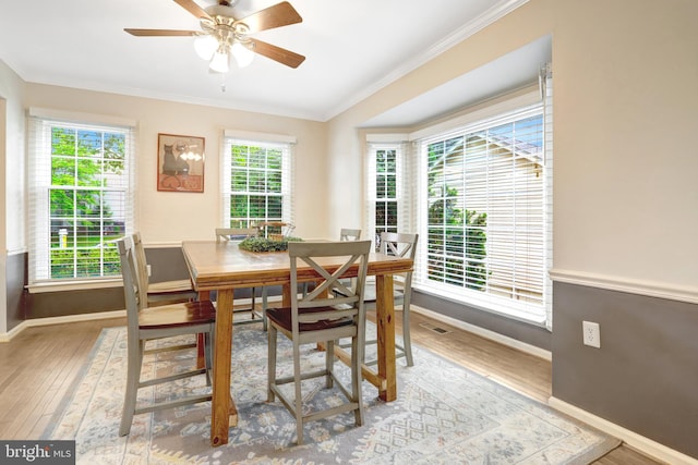 7117 Stanchion Ln, Burke, VA 22015 - dining space featuring ornamental molding, baseboards, wood finished floors, and a ceiling fan