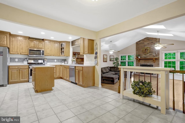 7117 Stanchion Ln, Burke, VA 22015 - kitchen with appliances with stainless steel finishes, open floor plan, ceiling fan, light countertops, and vaulted ceiling