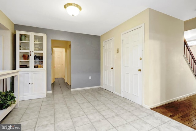 7117 Stanchion Ln, Burke, VA 22015 - empty room with stairs and baseboards