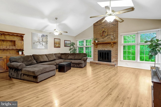 7117 Stanchion Ln, Burke, VA 22015 - living area featuring ceiling fan, wood finished floors, a fireplace, and high vaulted ceiling