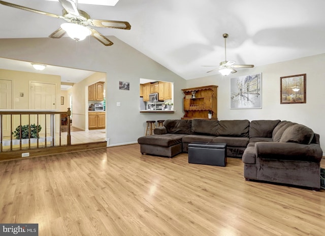 7117 Stanchion Ln, Burke, VA 22015 - living area featuring ceiling fan, light wood-style floors, lofted ceiling, and baseboards