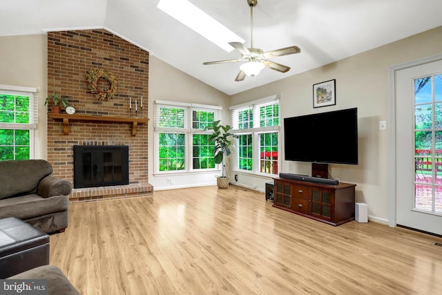 7117 Stanchion Ln, Burke, VA 22015 - living area with wood finished floors, vaulted ceiling, ceiling fan, baseboards, and a fireplace