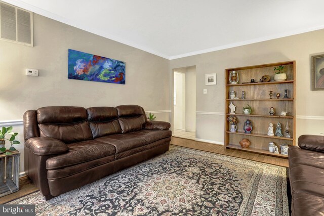 7117 Stanchion Ln, Burke, VA 22015 - living area featuring wood finished floors, ornamental molding, and baseboards