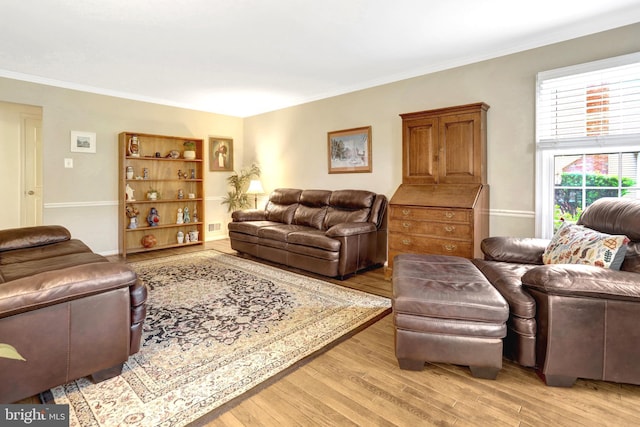 7117 Stanchion Ln, Burke, VA 22015 - living room featuring light wood-type flooring and ornamental molding