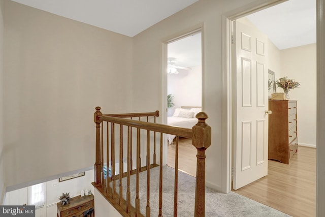 7117 Stanchion Ln, Burke, VA 22015 - staircase with baseboards, ceiling fan, and wood finished floors