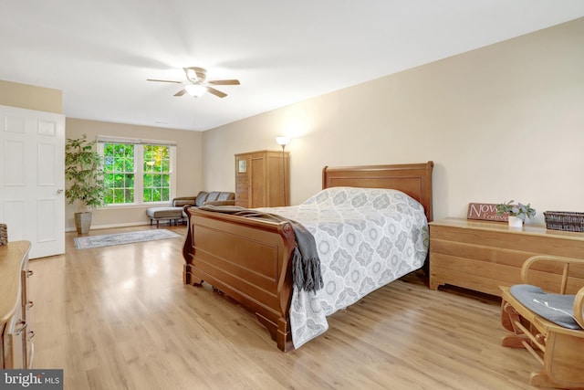 7117 Stanchion Ln, Burke, VA 22015 - bedroom with light wood-style floors and ceiling fan