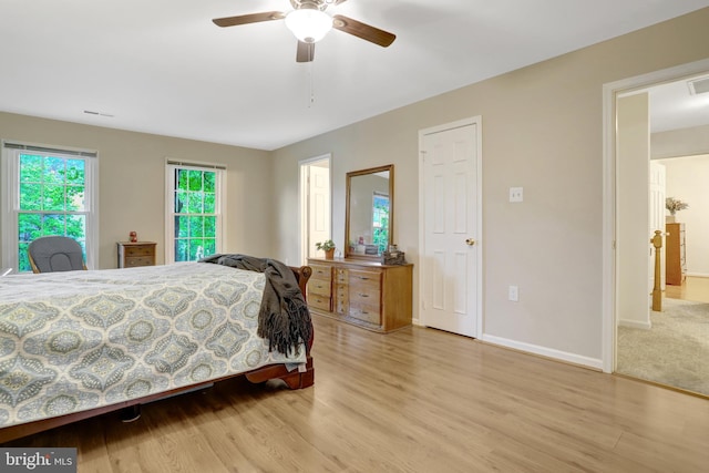7117 Stanchion Ln, Burke, VA 22015 - bedroom featuring wood finished floors, baseboards, and a ceiling fan