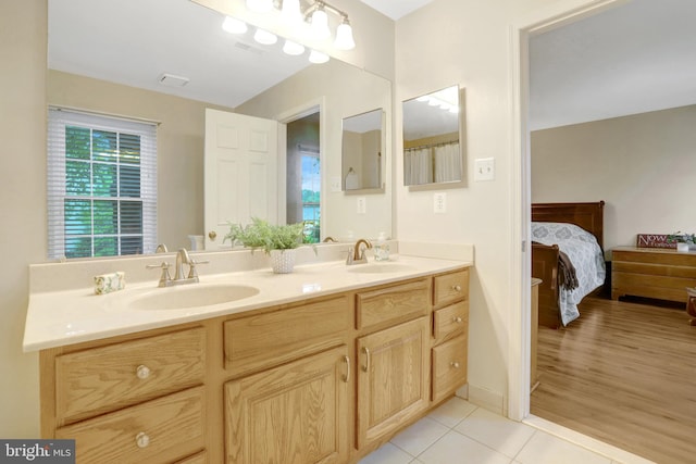 7117 Stanchion Ln, Burke, VA 22015 - full bathroom featuring connected bathroom, double vanity, and tile patterned floors