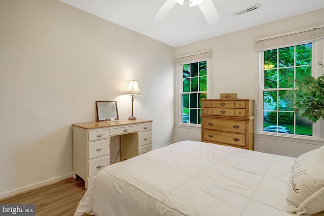7117 Stanchion Ln, Burke, VA 22015 - bedroom with light wood-type flooring, baseboards, and a ceiling fan