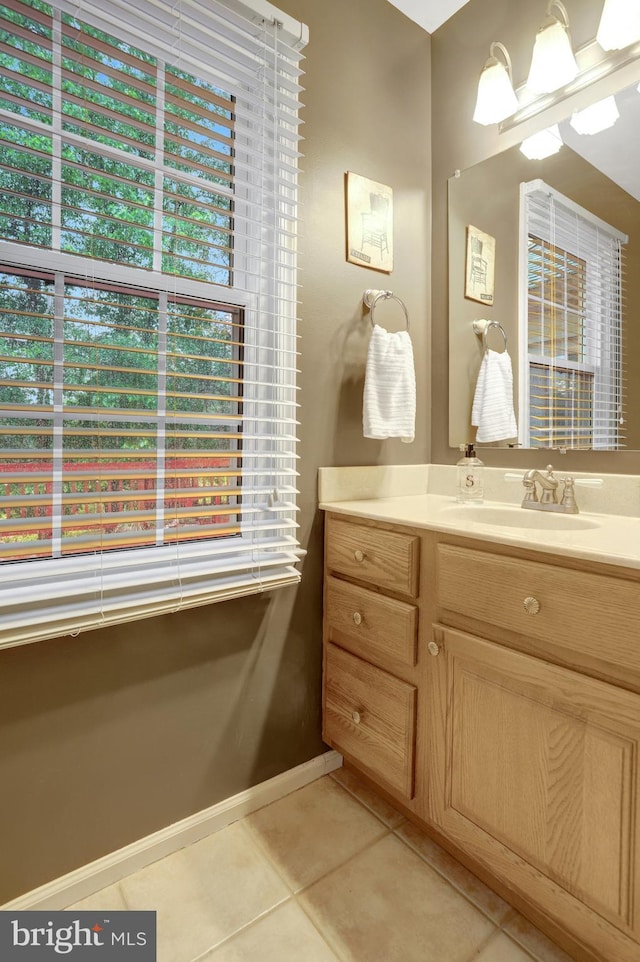 7117 Stanchion Ln, Burke, VA 22015 - bathroom featuring tile patterned floors, healthy amount of natural light, and vanity